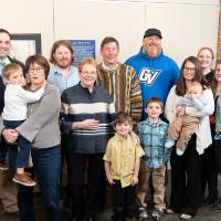 Lynn Blue posing with family at the Lynn M. Blue Connection Naming Ceremony